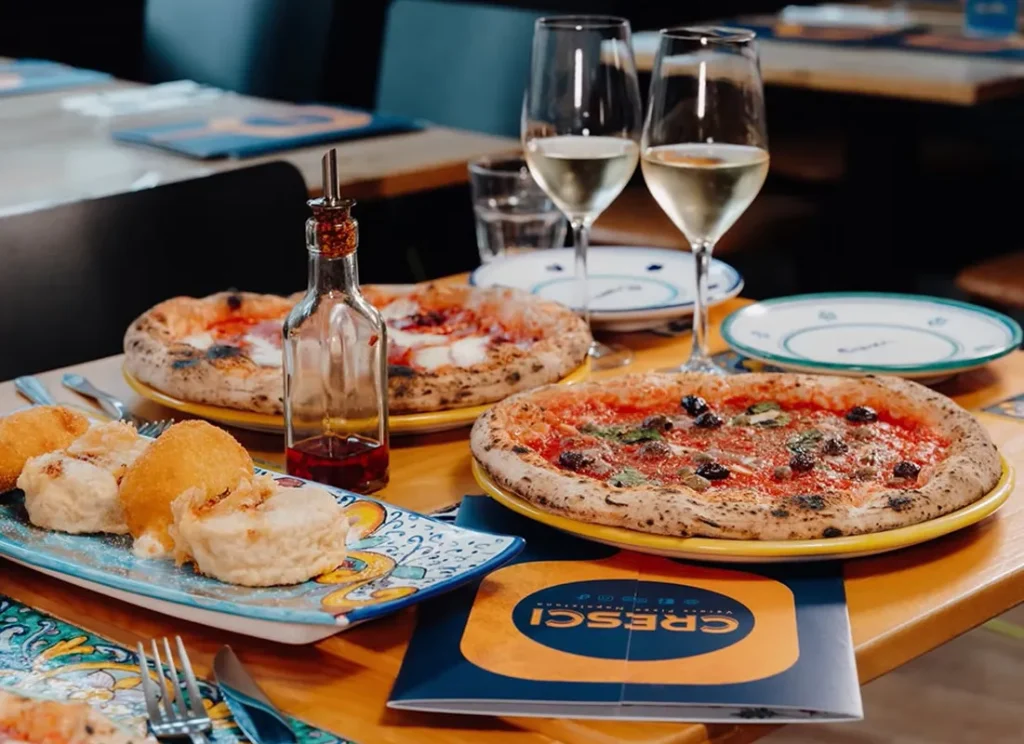 Neapolitan pizzas and wine at Cresci Pizzeria York near Hocus Pocus Tiny Hotel